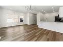 Bright living space with hardwood floors, recessed lighting, and a view into the kitchen at 3599 Brycewood Dr, Decatur, GA 30034