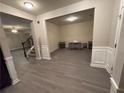 Formal dining room with hardwood floors and wainscoting at 15 Manas Ct, Covington, GA 30016