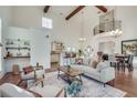 Inviting living room features high ceilings, hardwood floors, and an open connection to the kitchen at 3204 Woodrow Ne Way, Atlanta, GA 30319