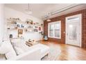 Spacious living room with exposed brick and hardwood floors at 791 Wylie Se St # 403, Atlanta, GA 30316