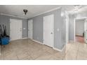 Spacious hallway with neutral walls and tile floors at 1489 New Hope Rd, Locust Grove, GA 30248