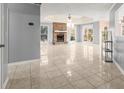 Spacious living room with fireplace and tile floors at 1489 New Hope Rd, Locust Grove, GA 30248