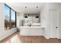 Modern kitchen with white cabinets, island, and stainless steel appliances at 105 Georgia Se Ave # 5, Atlanta, GA 30312