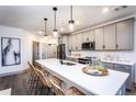 Modern kitchen with gray cabinets and stainless steel appliances at 3351 Orwell Way # 2206, Cumming, GA 30041