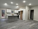 Modern kitchen featuring an island, stainless steel appliances, and white cabinets at 10033 Florence Cir, Villa Rica, GA 30180