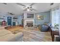 Living Room with hardwood floors, fireplace, and ceiling fan at 145 Turning Pt, Stockbridge, GA 30281