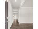 Bright entryway with hardwood floors and an open view to the living room at 37 Willow Green Trce, Dallas, GA 30157