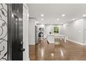 Open concept kitchen with island and stainless steel appliances at 2253 Bonnybrook Sw Way, Atlanta, GA 30311
