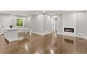 Spacious living area with hardwood floors and fireplace at 2253 Bonnybrook Sw Way, Atlanta, GA 30311