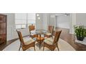 Charming dining area with glass-top table and wicker chairs at 3253 Long Creek Dr, Buford, GA 30519