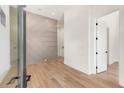Light-filled foyer with geometric wall accents and hardwood floors at 192 East Lake Se Ter, Atlanta, GA 30317