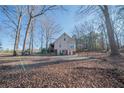 Rear view of house with large backyard and basketball court at 633 Duncan Rd, Oxford, GA 30054