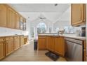 Kitchen with light wood cabinets and stainless steel appliances at 895 Dogwood Park Dr, Lawrenceville, GA 30046