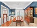 Formal dining room with hardwood floors, large windows, and a beautiful chandelier at 1037 Emory Parc Pl, Decatur, GA 30033