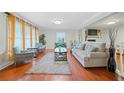 Inviting living room with hardwood floors, neutral decor, plush seating, and ample natural light at 1354 Drayton Woods Dr, Tucker, GA 30084