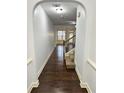Bright entryway with hardwood floors and an arched hallway at 2249 Knoxhill Se Vw, Smyrna, GA 30082