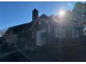Side view of the house showcasing garage and shutters at 3709 Charlotte Dr, Rex, GA 30273