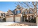 Two-story house with three car garage, brick and siding at 706 Independence Ln, Acworth, GA 30102