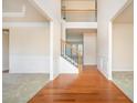Two-story foyer with hardwood floors and an open staircase at 558 Olympic Way, Acworth, GA 30102