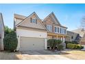 Two-story house with stone accents and a large front yard at 558 Olympic Way, Acworth, GA 30102