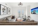 Bright living area featuring sectional sofa and large TV at 2277 Peachtree Ne Rd # 405, Atlanta, GA 30309