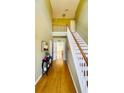 Spacious foyer with hardwood floors and a staircase leading to the upper level at 2710 Factor Walk Blvd, Suwanee, GA 30024