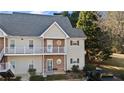 Two-story townhome with balcony and brick facade at 1709 Bald Ridge Marina Rd # 4, Cumming, GA 30041