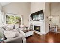 Inviting living room featuring a fireplace, hardwood floors and large windows with natural light at 1709 Bald Ridge Marina Rd # 4, Cumming, GA 30041