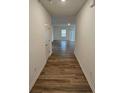 Bright entryway with wood-look flooring leading to the living room at 771 Gelderland Dr, Hampton, GA 30228