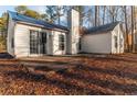 House back view with patio and trees at 415 Rockingham Ln, Woodstock, GA 30189