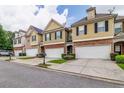 Attractive townhomes each with a private garage, manicured lawn and tasteful brick details at 53 Providence Oak Ct, Lawrenceville, GA 30046
