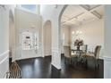 Elegant dining room with hardwood floors and a glass-top table at 105 Couch Ct, Fayetteville, GA 30214