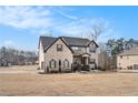 Two story brick home situated on a spacious lot with mature trees at 105 Couch Ct, Fayetteville, GA 30214