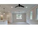 Bright dining room features hardwood floors, chandelier, and access to the backyard at 163 Bluffington Way, Marietta, GA 30066