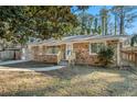 Ranch house with a yard and trees, newly renovated at 1189 Rock Cut Rd, Forest Park, GA 30297