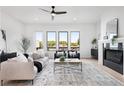 Cozy living room with fireplace, large windows, and modern decor creating an inviting atmosphere at 3072 Kelly St, Scottdale, GA 30079