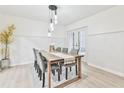 Bright dining room with a wood table and six chairs, perfect for entertaining at 4083 Audubon Dr, Marietta, GA 30068