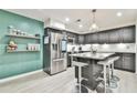 Modern kitchen featuring stainless steel appliances and an island with seating at 4083 Audubon Dr, Marietta, GA 30068