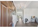Welcoming foyer features wood floors, decorative moldings, and a view of the living area at 1920 Pearson St, Loganville, GA 30052