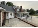 Home with sunroom, deck and fenced pool at 1294 Dogwood Rd, Snellville, GA 30078