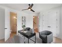 Home office space with modern design, fan, and bathroom access at 3076 Kelly St, Scottdale, GA 30079