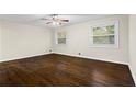 A well-lit bedroom features wood flooring and large windows that allow natural light at 2771 Ridge Park Dr, Tucker, GA 30084