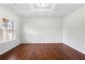 Spacious living room with hardwood floors and white walls at 4302 Maclaren Ct, Powder Springs, GA 30127