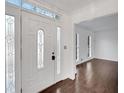 Bright entryway with hardwood floors and a glass door at 2530 Ashbourne Dr, Lawrenceville, GA 30043