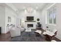 Bright living room features hardwood floors, comfortable seating, and a fireplace at 1200 Ponce De Leon Ne Ave # A1, Atlanta, GA 30306