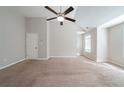 Bright bedroom featuring neutral walls and carpet at 7110 Ravenwood Ln, Lithonia, GA 30038
