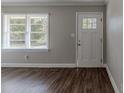 Bright entryway with new flooring and updated door at 1255 Glen Forest Way, Decatur, GA 30032