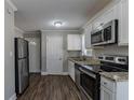 Modern kitchen with stainless steel appliances and granite countertops at 1255 Glen Forest Way, Decatur, GA 30032