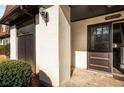 Inviting building entryway with a brown door and landscaping at 175 Rue Fontaine, Lithonia, GA 30038