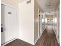 Clean hallway with light walls and wood-look flooring at 175 Rue Fontaine, Lithonia, GA 30038